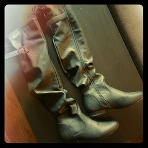 Over the knee high riding slouch boots